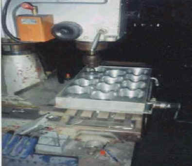 Aluminum cast tooling being cut